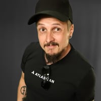 A picture of Janne Toivonen, a Senior Atlassian Consultant at Eficode, wearing a black cap and t-shirt with Atlassian logo in the front.